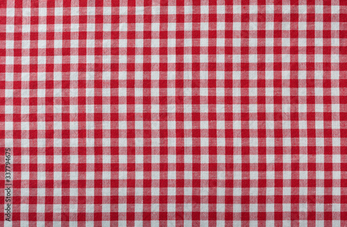 red checkered fabric tablecloth as background