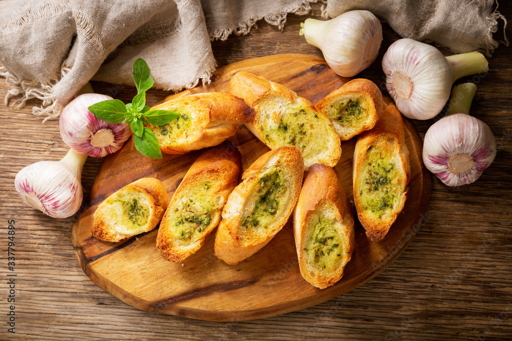 fresh garlic bread with herbs, top view