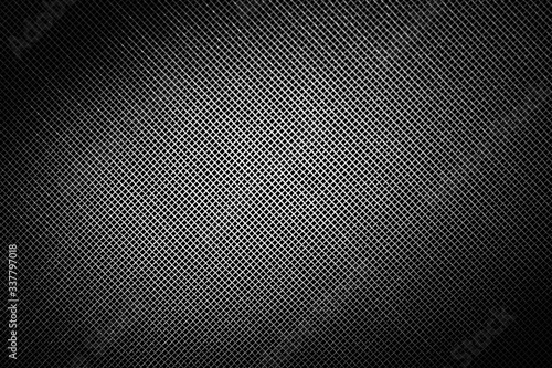 abstract black and white dark background made with grid and spots of light photo