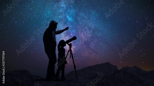 Man Father With Daughter Child Photographs And Observes Night Starry Sky