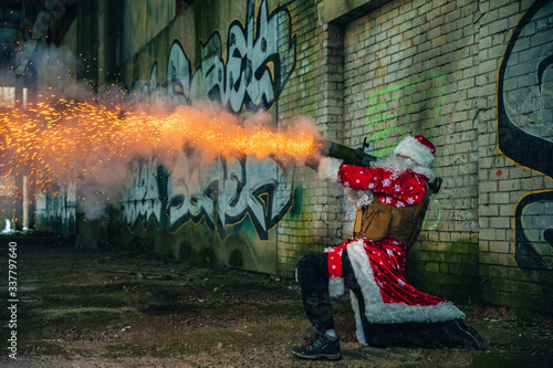 Santa Claus with a grenade launcher in an abandoned warehouse