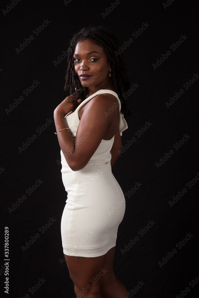 Thoughtful Black woman in a white dress Thoughtful Black woman in a white dress