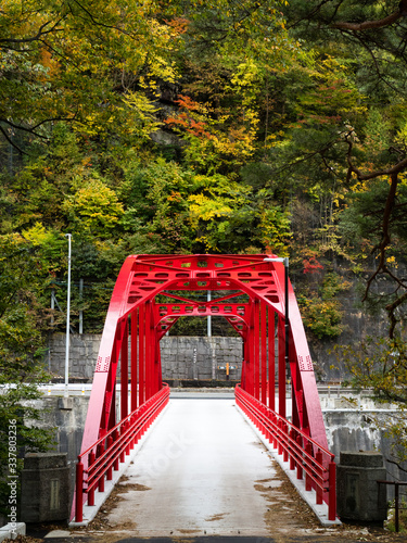 Red bridge over the Kiso river at Kiso-no-Kakehashi, a scenic spot in Kiso valley photo
