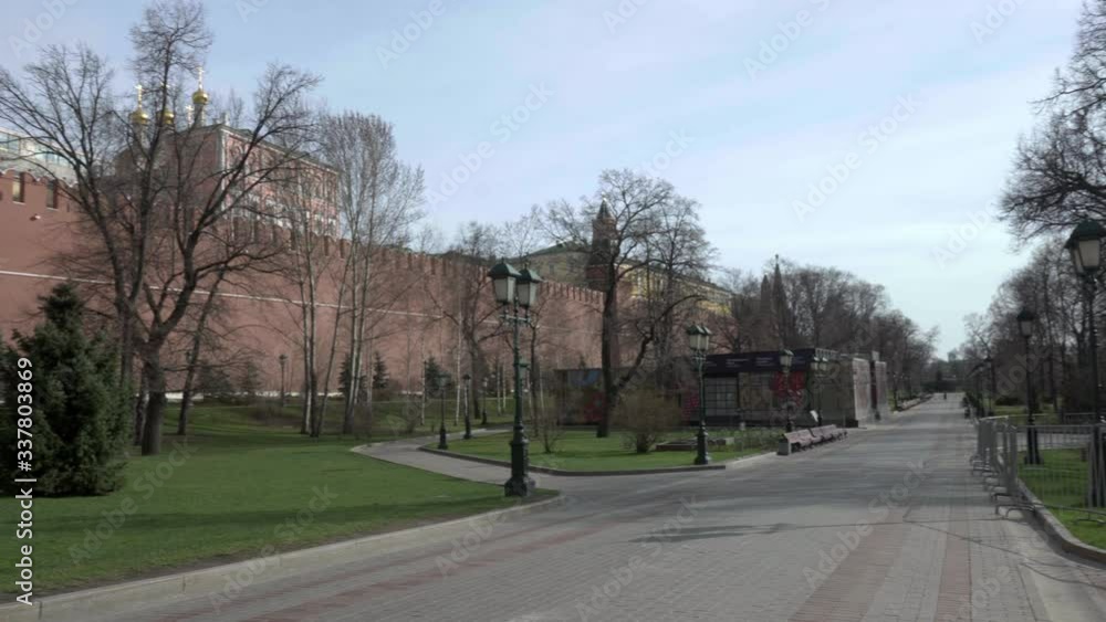 Moscow, Russia. April 10.2020. Alexander garden is empty. No people in the Park. Red wall. Moscow, Russia. April 10.2020. Alexander garden is empty. No people in the Park. Red wall.