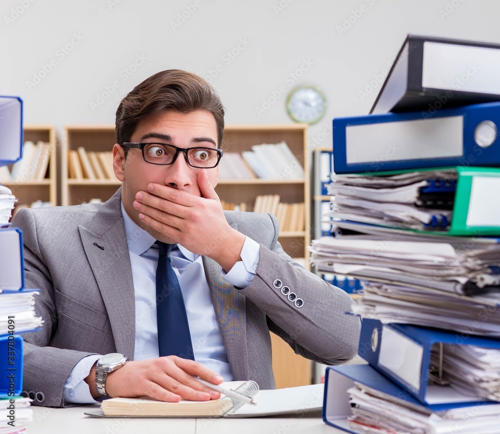 Fototapeta premium Busy businessman under stress due to excessive work