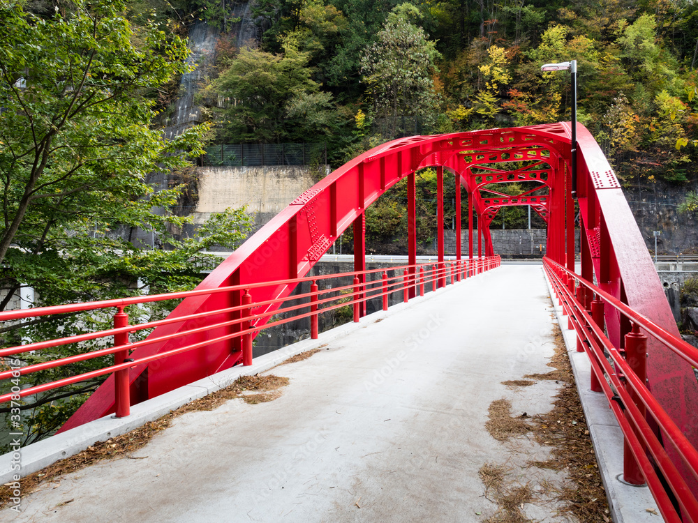 Red bridge over the Kiso river at Kiso-no-Kakehashi, a scenic spot in Kiso valley - Nagano prefecture, Japan Red bridge over the Kiso river at Kiso-no-Kakehashi, a scenic spot in Kiso valley - Nagano prefecture, Japan
