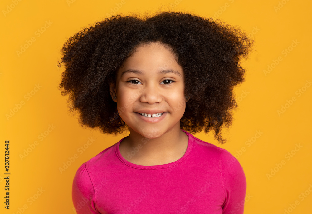 Positive Cute Black Kid, Little Girl, Posing At Camera And Smiling