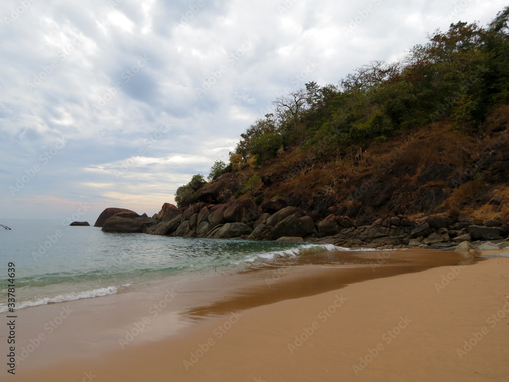 Beautiful beach with rocks at dusk