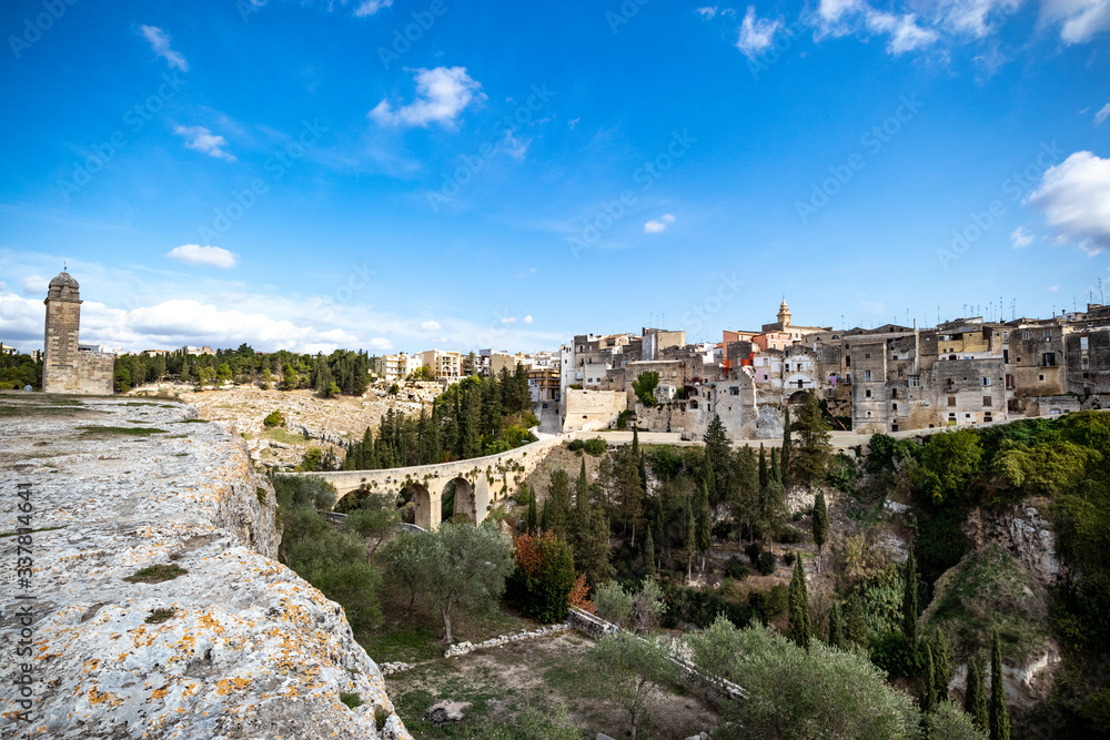 suggestive view of the Gravina and the rock churches (Gravina with the meaning of rock, shaft and erosion of bank river). Gravina in Puglia ancient town, bridge and canyon. Apulia, Italy, Europe