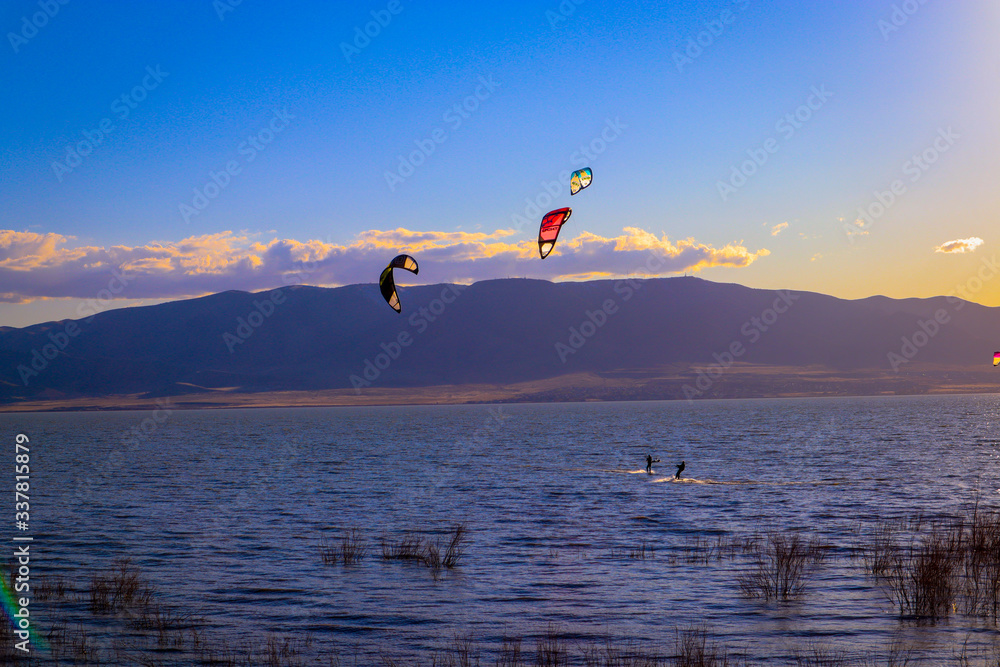 kitesurfing in Utah Lake at sunset Stock Photo Adobe Stock
