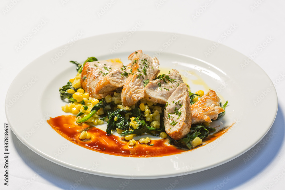 Grilled chicken breasts with cooked vegetables corn and chard Grilled chicken breasts with cooked vegetables corn and chard