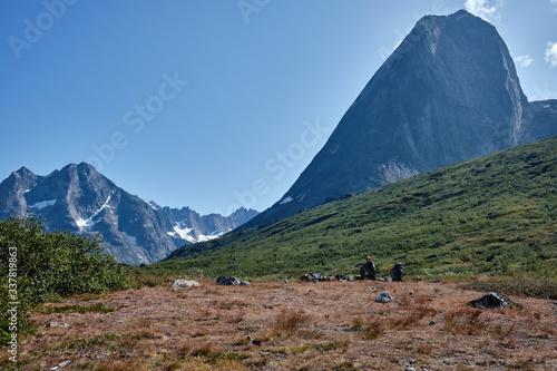 Man sitting in mountain landscape in the mountains 