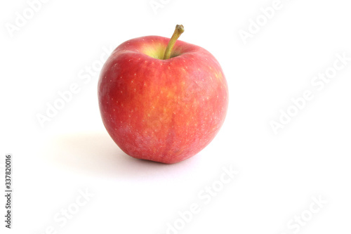 Beautiful fresh red gala apple with stem on the top isolated on white background. Cooking Ingredients Theme.