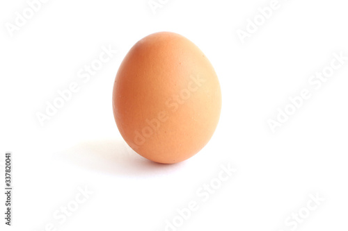 Beautiful fresh chicken brown egg with shadow isolated on white background. Cooking Ingredients Theme.