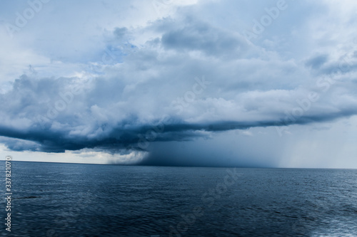 storm clouds over sea in a blue background.  © Rocío González 