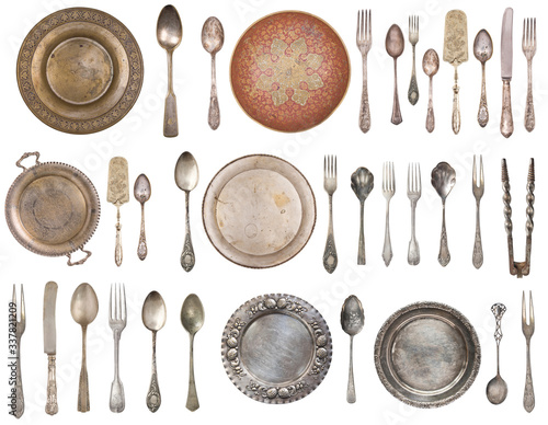 Vintage Silverware, antique spoons, forks, knives, cake shovels and dishes isolated on isolated white background. Antique silverware. Retro.