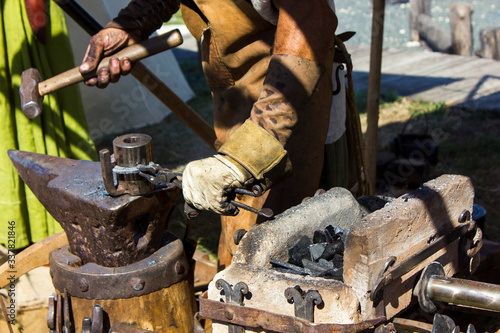 Blacksmith makes a horseshoe, a master class in medieval craft