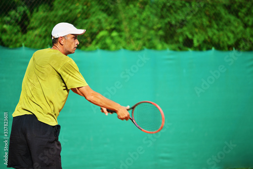 Tennis player in an action.Copy space © Avatar_023