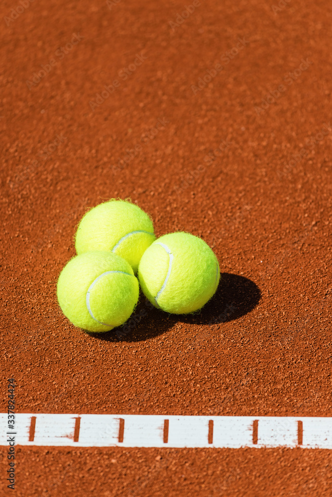 Tennis balls on a tennis court.Shallow doff