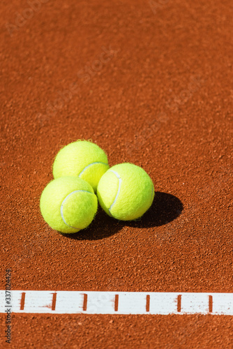 Tennis balls on a tennis court.Shallow doff © Avatar_023