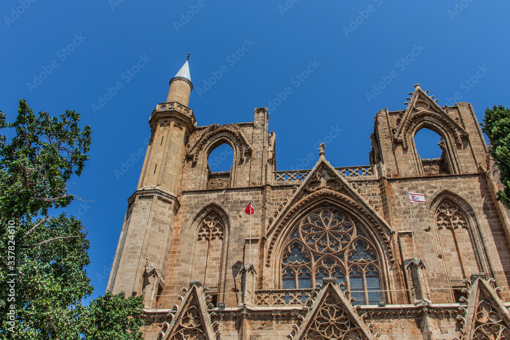 gothic cathedral rebuilt to mosque in famagusta on north cyprus and blue sky