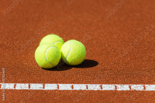 Tennis balls on a tennis court.Shallow doff © Avatar_023