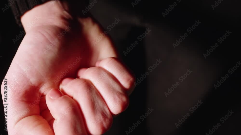 Girl opens fist and shows opened palm with pill Girl opens fist and shows opened palm with pill