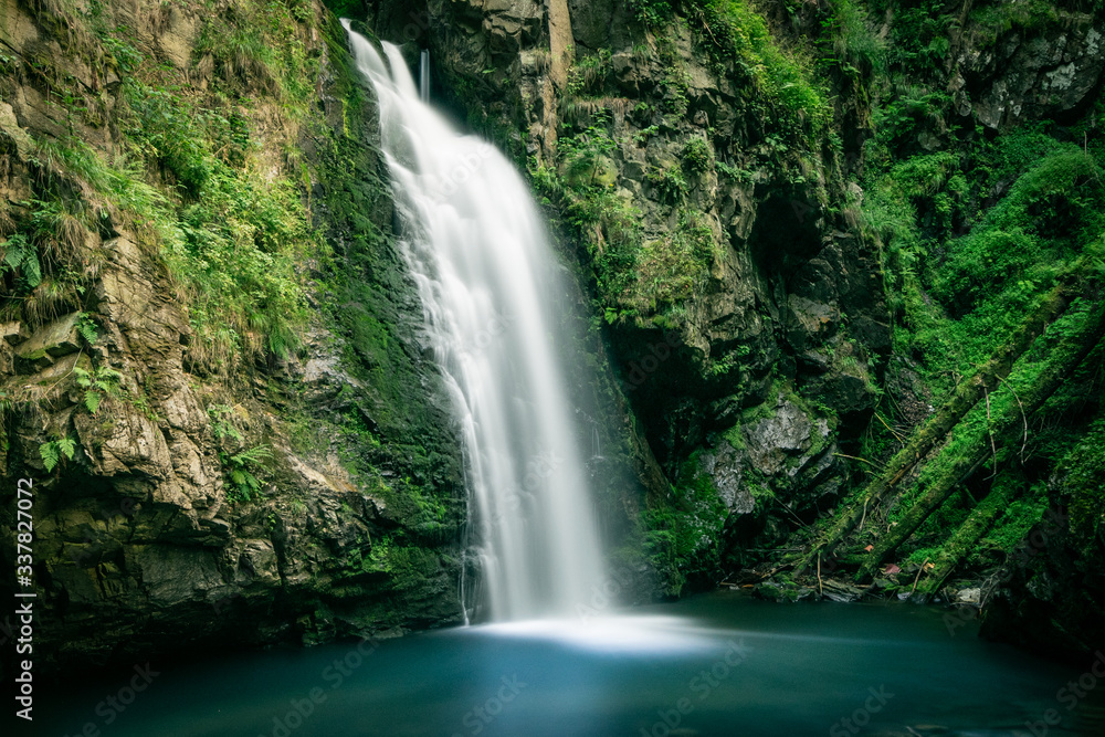 Long exposure photograph of mountain waterfall. Landscape of Miedzygorze, Sudety, Poland. Long exposure photograph of mountain waterfall. Landscape of Miedzygorze, Sudety, Poland.