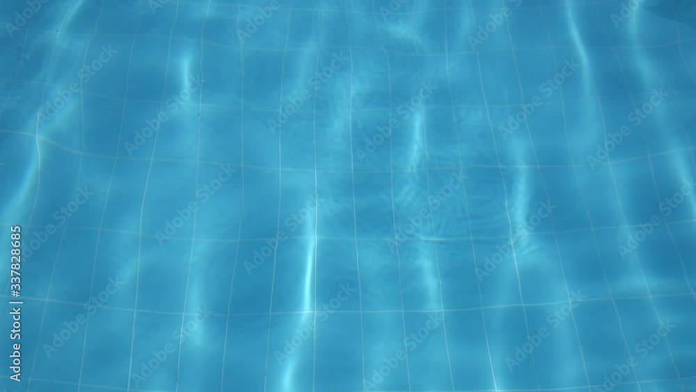 Flickering waves of clear water in the pool Flickering waves of clear water in the pool