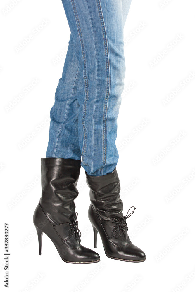 beautiful shapely pair of legs in black short boots isolated on white background beautiful shapely pair of legs in black short boots isolated on white background