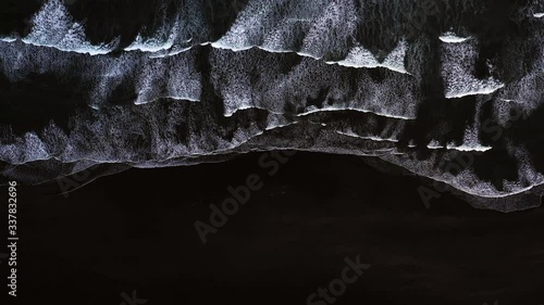 Top down view of giant ocean waves crashing and foaming