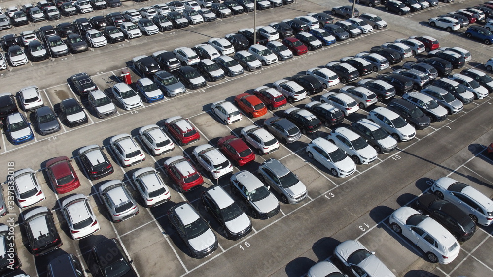 Fototapeta premium LOGISTIC AND TRADE AUTOMOBILE CENTER. DRONE AERIAL PHOTO. VEHICLE PARK