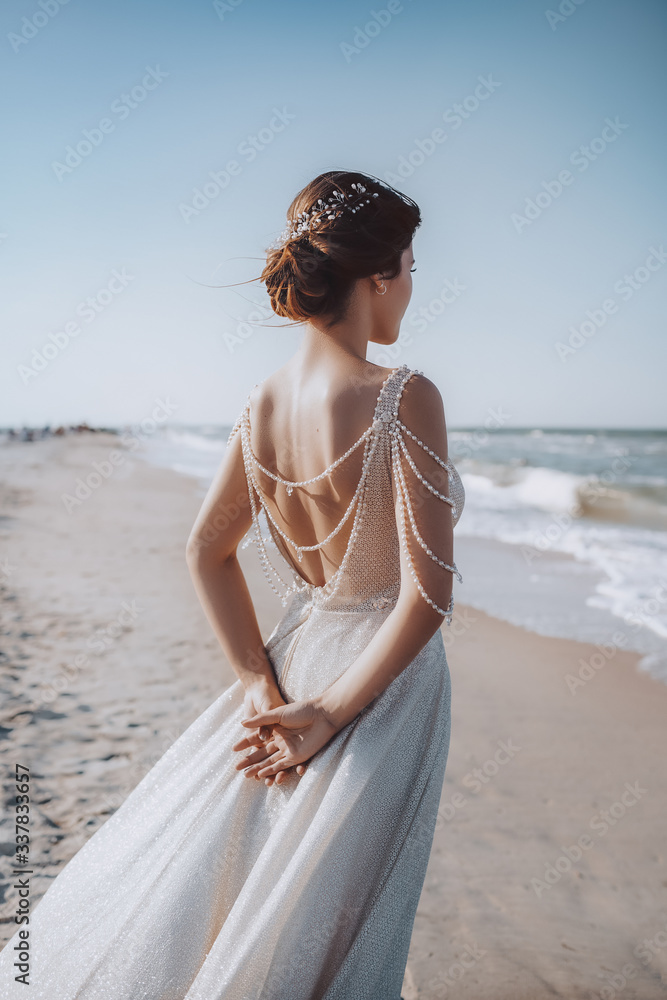 Beautiful brunette bride with stylish make-up in white dress Beautiful brunette bride with stylish make-up in white dress