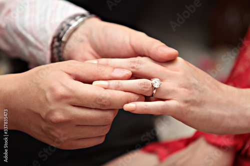 Man giving an engagement ring to his girlfriend 