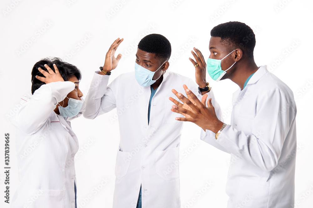 A consultation of doctors who discuss the diagnosis. Doctors on a white background. A consultation of doctors who discuss the diagnosis. Doctors on a white background.