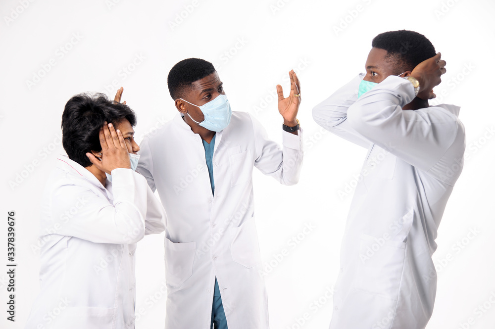 A consultation of doctors who discuss the diagnosis. Doctors on a white background. A consultation of doctors who discuss the diagnosis. Doctors on a white background.