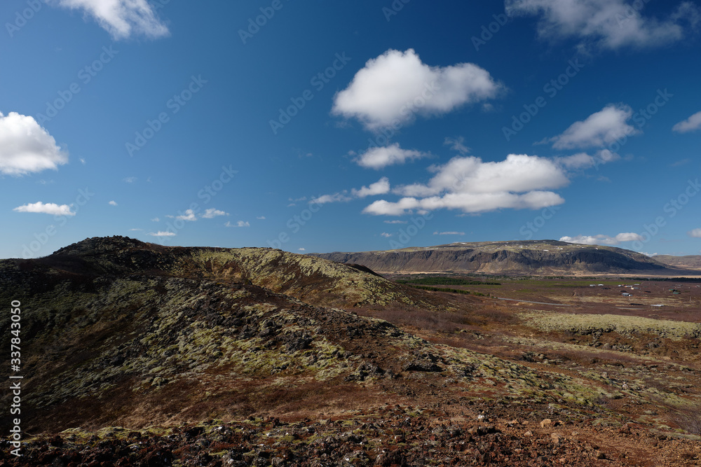 The Icelandic landscape seen from the rim at top of Kerid Volcano crater