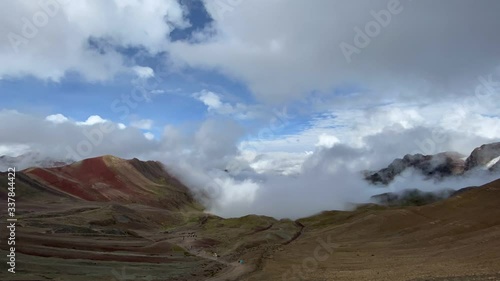 Peru Rainbow Mountain Vinicunca TIMELAPSE Time Lapse Time-Lapse Overlooking Valley with Rolling Clouds and Mountain gets enveloped in clouds photo