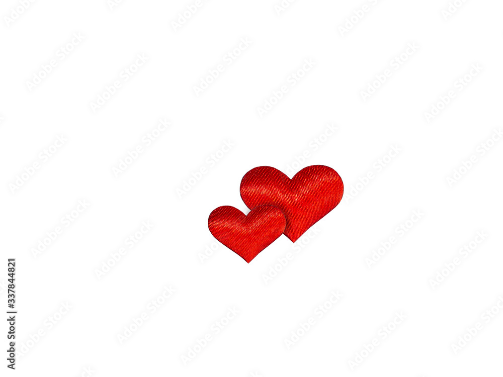 Two red silk hearts on a white isolated background. Symbol of love, family