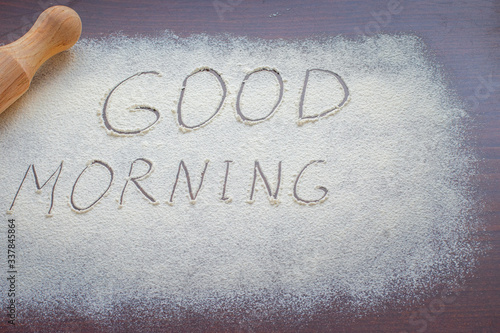 inscription on white flour "good morning"