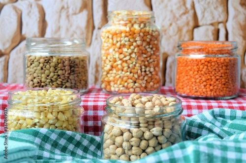  background of edible pulses in a glass jar