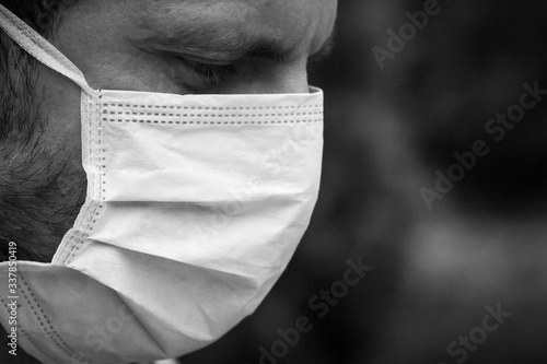 Obraz na płótnie Man suffering of covid pandemic in Madrid, Spain with a mask on his face w salonie