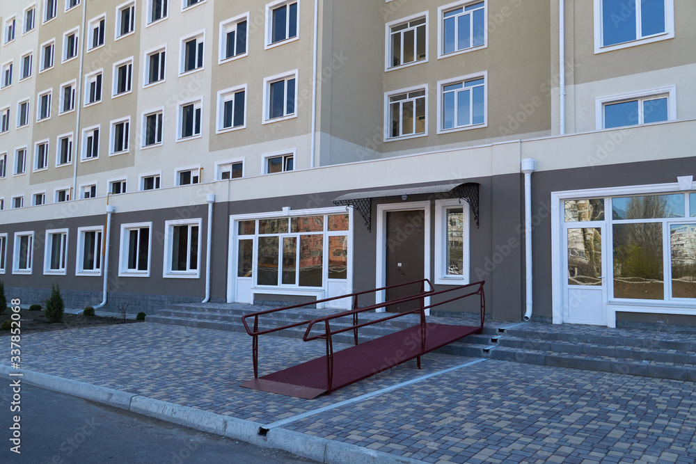 Wheelchair access ramp for entrance of residential multistory building ...