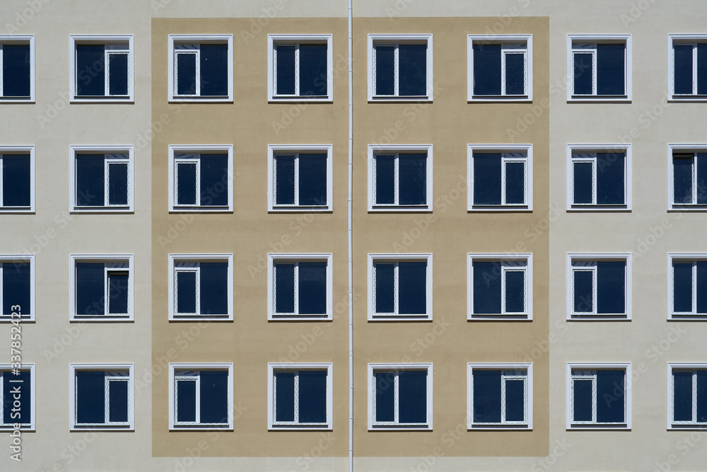 facade of a new multi-storey building with many windows facade of a new multi-storey building with many windows