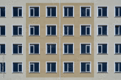 facade of a new multi-storey building with many windows © soleg