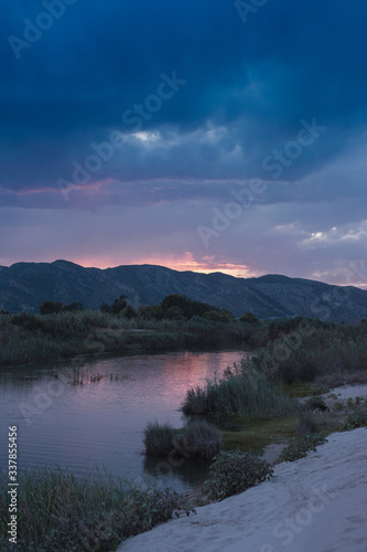 landscape on the background mountain beach along the river at sunset iwith purple sky n xeraco, valencia