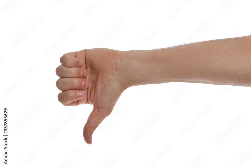 Man showing thumb down gesture against white background, closeup of hand Man showing thumb down gesture against white background, closeup of hand