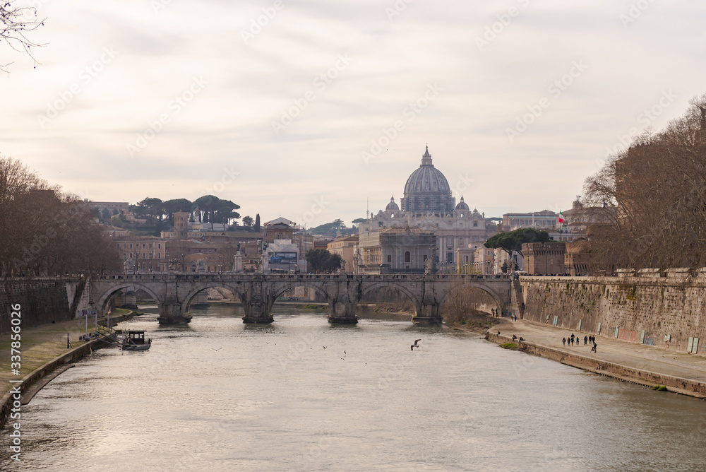 Roman embankment and the dome of the Vatican. Morning in Rome before the introduction of the quarantine. The Tiber river in the center of Rome.