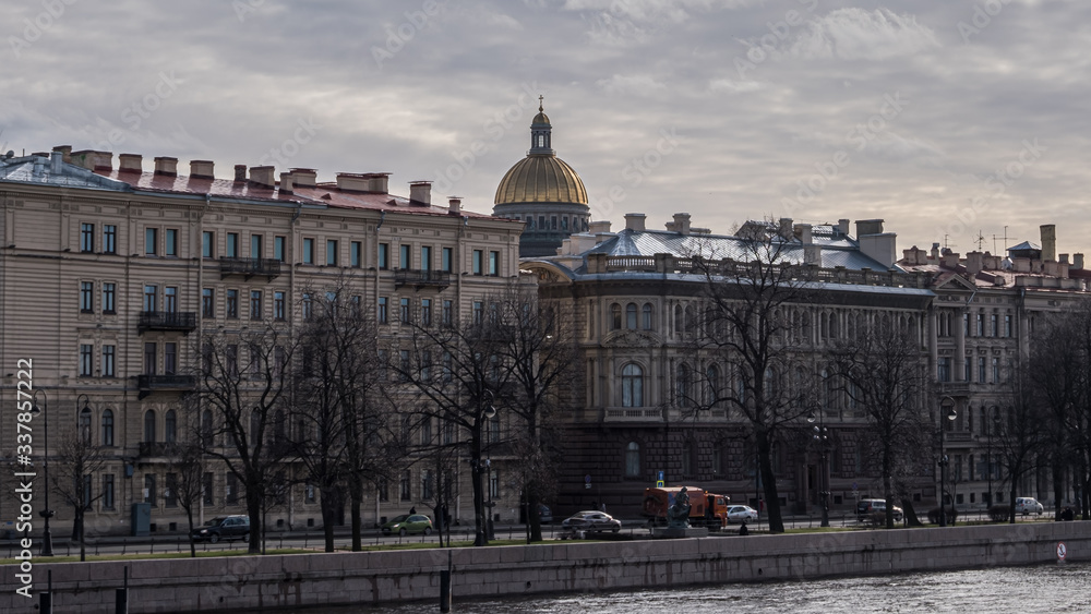 Buildings on the banks of the Neva and the gilded dome of St. Isaac's Cathedral.