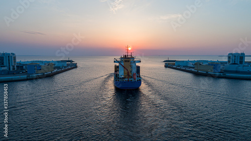 Tableau sur toile Aerial view at sunset of a cargo ship in the Gulf of Finland